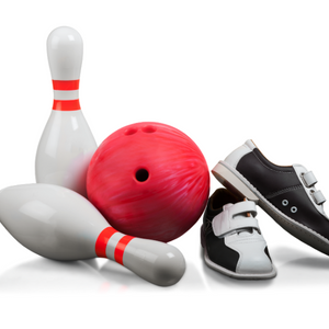 Two white bowling pins with two red stripes on each , one is standing and the other is laying down nest to a red bowling ball and a pair of black and white bowling shoes.